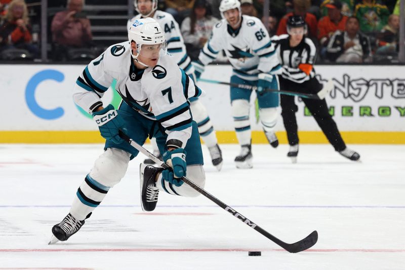 Nov 12, 2023; Anaheim, California, USA; San Jose Sharks center Nico Sturm (7) skates with the puck during the first period against the Anaheim Ducksa at Honda Center. Mandatory Credit: Jason Parkhurst-USA TODAY Sports