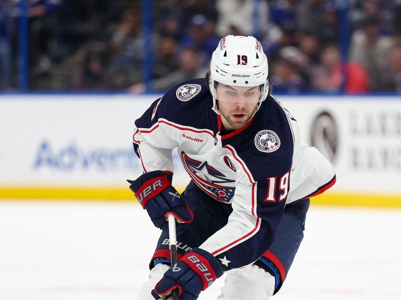 Mar 4, 2025; Tampa, Florida, USA; Columbus Blue Jackets center Adam Fantilli (19) controls the puck against the Tampa Bay Lightning in the first period at Amalie Arena. Mandatory Credit: Nathan Ray Seebeck-Imagn Images