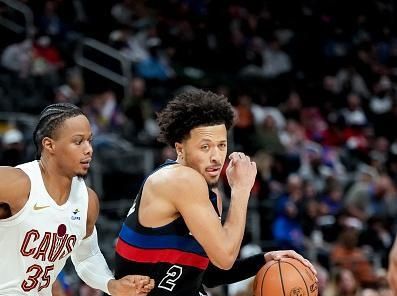 DETROIT, MICHIGAN - DECEMBER 02: Cade Cunningham #2 of the Detroit Pistons handles the ball against Isaac Okoro #35 of the Cleveland Cavaliers during the third quarter at Little Caesars Arena on December 02, 2023 in Detroit, Michigan. NOTE TO USER: User expressly acknowledges and agrees that, by downloading and or using this photograph, User is consenting to the terms and conditions of the Getty Images License Agreement. (Photo by Nic Antaya/Getty Images)