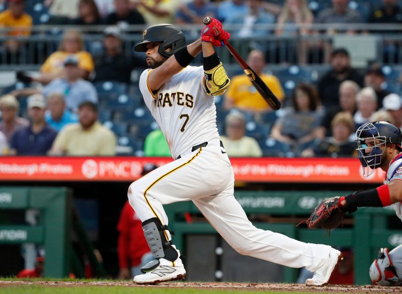 Sep 5, 2024; Pittsburgh, Pennsylvania, USA;  Pittsburgh Pirates shortstop Isiah Kiner-Falefa (7) hits a RBI single against the Washington Nationals during the second inning at PNC Park. Mandatory Credit: Charles LeClaire-Imagn Images