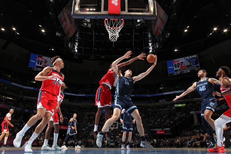 MEMPHIS, TN - NOVEMBER 8: Zach Edey #14 of the Memphis Grizzlies handles the ball during the game against the Washington Wizards on November 8, 2024 at FedExForum in Memphis, Tennessee. NOTE TO USER: User expressly acknowledges and agrees that, by downloading and or using this photograph, User is consenting to the terms and conditions of the Getty Images License Agreement. Mandatory Copyright Notice: Copyright 2024 NBAE (Photo by Joe Murphy/NBAE via Getty Images)