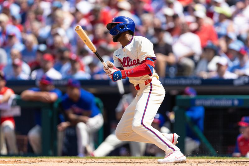 May 8, 2024; Philadelphia, Pennsylvania, USA; Philadelphia Phillies outfielder Johan Rojas (18) hits a single during the third inning against the Toronto Blue Jays at Citizens Bank Park. Mandatory Credit: Bill Streicher-USA TODAY Sports