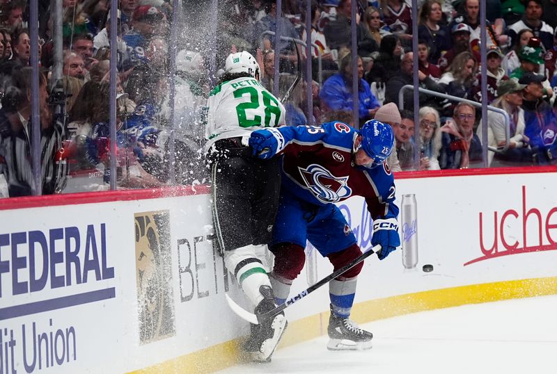 Mar 25, 2025; Denver, Colorado, USA; Colorado Avalanche right wing Logan O'Connor (25) checks Dallas Stars defenseman Alexander Petrovic (28) in the second period at Ball Arena. Mandatory Credit: Ron Chenoy-Imagn Images