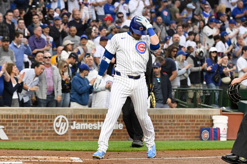 May 16, 2024; Chicago, Illinois, USA;   Chicago Cubs outfielder Ian Happ (8) celebrates after hitting a home run against the Pittsburgh Pirates during the second inning at Wrigley Field. Mandatory Credit: Matt Marton-USA TODAY Sports