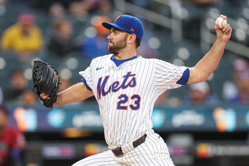 Apr 29, 2025; New York City, New York, USA; New York Mets starting pitcher David Peterson (23) delivers a pitch during the first inning against the Arizona Diamondbacks at Citi Field. Mandatory Credit: Vincent Carchietta-Imagn Images
