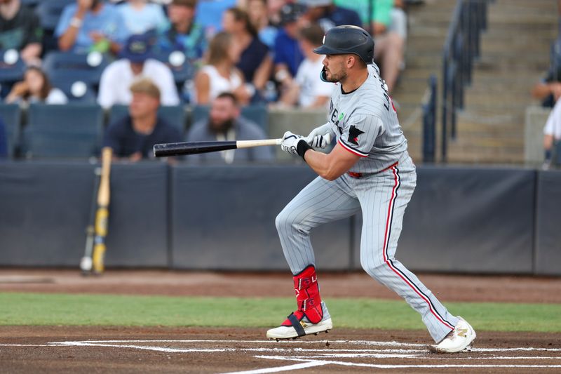 May 27, 2025; Tampa, Florida, USA; Minnesota Twins right fielder Trevor Larnach (9) doubles against the Tampa Bay Rays in the first inning at George M. Steinbrenner Field. Mandatory Credit: Nathan Ray Seebeck-Imagn Images