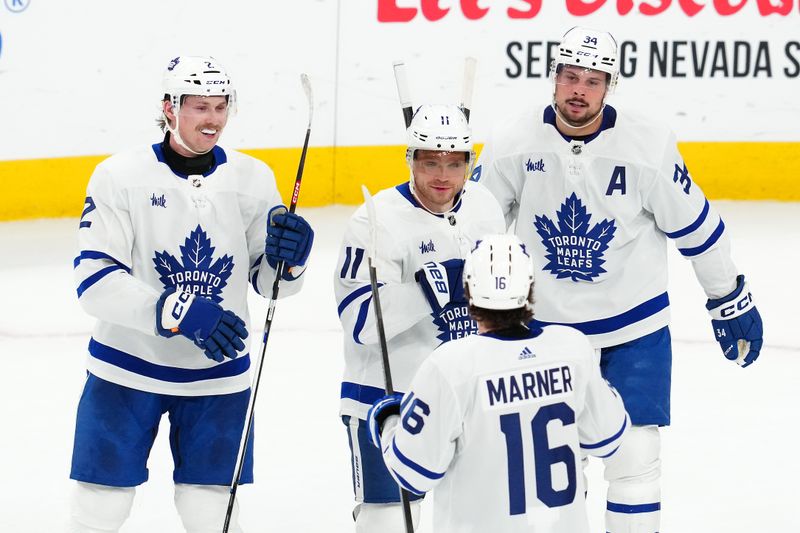 Feb 22, 2024; Las Vegas, Nevada, USA; Toronto Maple Leafs center Max Domi (11) celebrates with team mates after scoring a goal against the Vegas Golden Knights during the second period at T-Mobile Arena. Mandatory Credit: Stephen R. Sylvanie-USA TODAY Sports