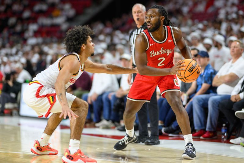 Dec 4, 2024; College Park, Maryland, USA; Ohio State Buckeyes guard Bruce Thornton (2) looks to pass the ball against Maryland Terrapins guard Ja'Kobi Gillespie (0) during the first half at Xfinity Center. Mandatory Credit: Reggie Hildred-Imagn Images