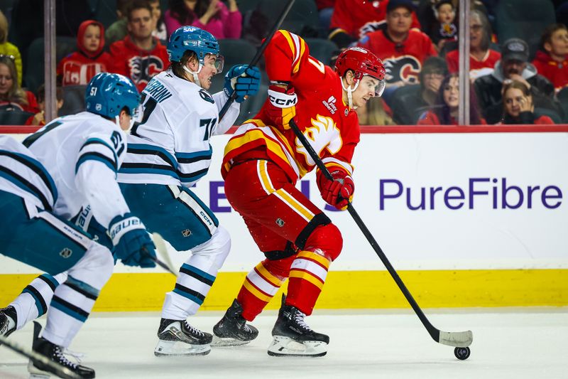 Jan 31, 2026; Calgary, Alberta, CAN; Calgary Flames center Yegor Sharangovich (17) controls the puck against San Jose Sharks center MacKlin Celebrini (71) during the first period at Scotiabank Saddledome. Mandatory Credit: Sergei Belski-Imagn Images