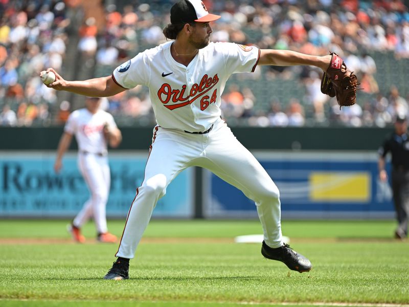 Jul 14, 2024; Baltimore, Maryland, USA;  Baltimore Orioles pitcher Dean Kremer (64) fields a bunt during the first inning against the New York Yankees at Oriole Park at Camden Yards. Mandatory Credit: James A. Pittman-USA TODAY Sports