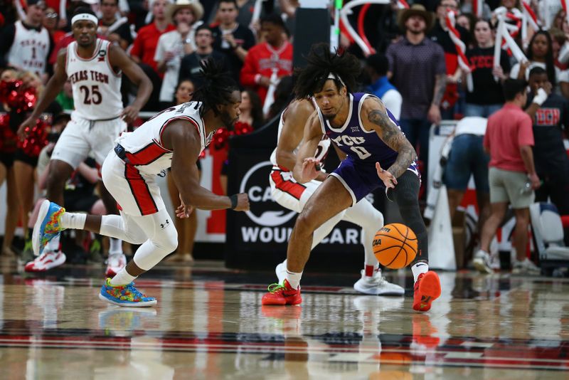 Feb 20, 2024; Lubbock, Texas, USA;  TCU Horned Frogs guard Micah Peavy (0) and Texas Tech Red Raiders guard Joe Toussaint (6) go after a loose ball in the second half at United Supermarkets Arena. Mandatory Credit: Michael C. Johnson-USA TODAY Sports