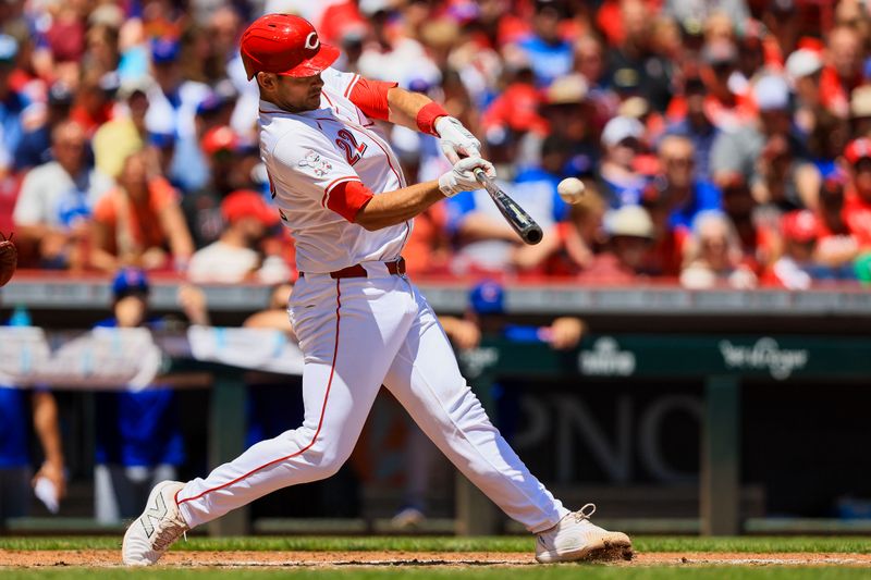 Jun 9, 2024; Cincinnati, Ohio, USA; Cincinnati Reds catcher Luke Maile (22) hits a solo home run in the third inning against the Chicago Cubs at Great American Ball Park. Mandatory Credit: Katie Stratman-USA TODAY Sports