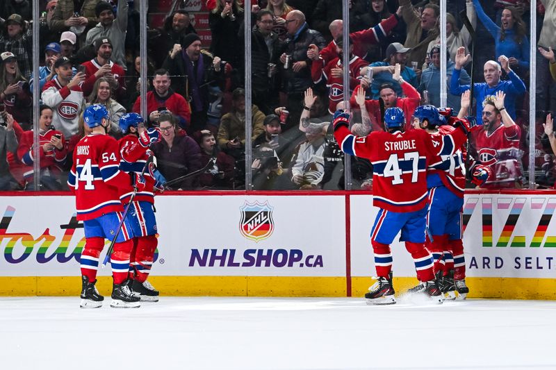 Jan 15, 2024; Montreal, Quebec, CAN; Montreal Canadiens playsrs gather around Montreal Canadiens left wing Rafael Harvey-Pinard (49) to celebrate his goal against the Colorado Avalanche during the second period at Bell Centre. Mandatory Credit: David Kirouac-USA TODAY Sports