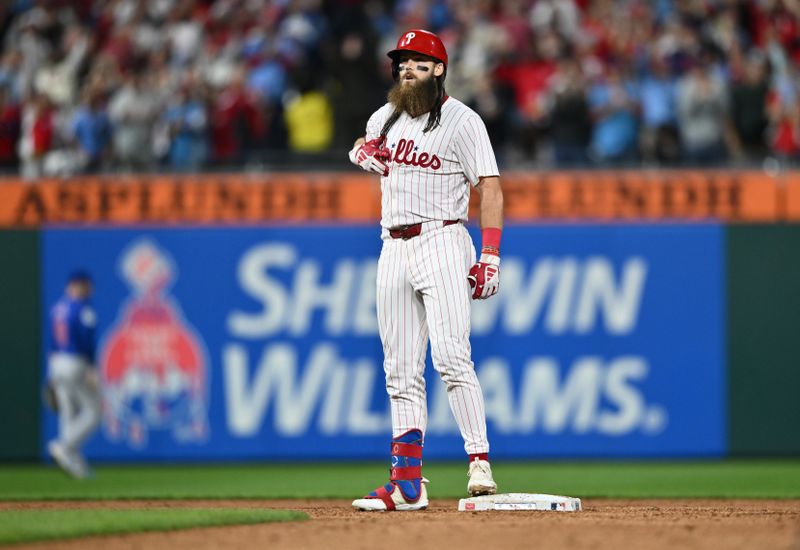 Sep 25, 2024; Philadelphia, Pennsylvania, USA; Philadelphia Phillies outfielder Brandon Marsh (16) reacts after hitting an RBI double against the Chicago Cubs in the fifth inning at Citizens Bank Park. Mandatory Credit: Kyle Ross-Imagn Images