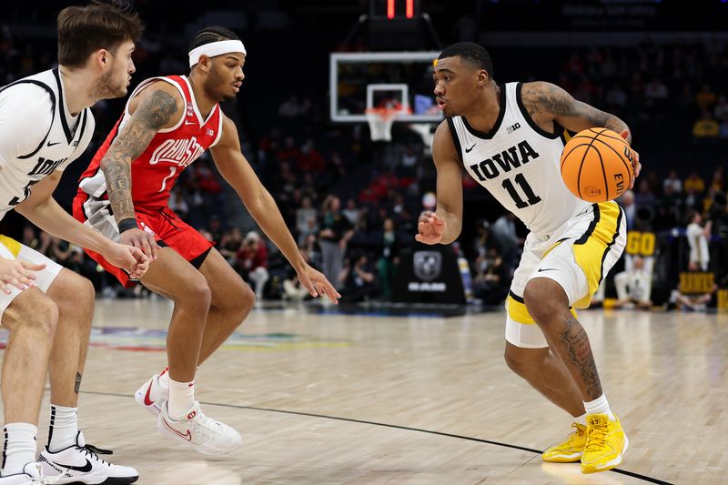 Mar 14, 2024; Minneapolis, MN, USA; Iowa Hawkeyes guard Tony Perkins (11) dribbles as Ohio State Buckeyes guard Roddy Gayle Jr. (1) defends during the first half at Target Center. Mandatory Credit: Matt Krohn-USA TODAY Sports