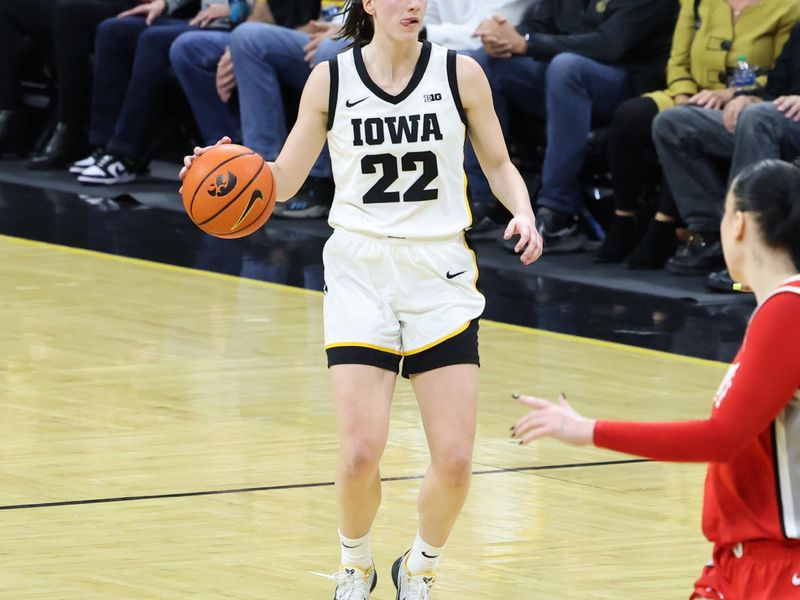 Mar 3, 2024; Iowa City, Iowa, USA;  Iowa Hawkeyes guard Caitlin Clark (22) sets the offense against the Ohio State Buckeyes during the first half at Carver-Hawkeye Arena. Mandatory Credit: Reese Strickland-USA TODAY Sports