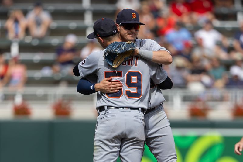 Aug 16, 2023; Minneapolis, Minnesota, USA; Detroit Tigers shortstop Zach McKinstry (39) and second baseman Zack Short (59) celebrate after defeating the Minnesota Twins at Target Field. Mandatory Credit: Jesse Johnson-USA TODAY Sports