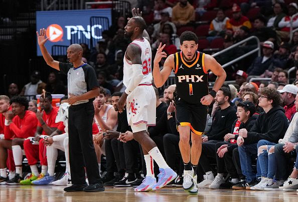 HOUSTON, TEXAS - DECEMBER 27: Devin Booker #1 of the Phoenix Suns reacts after sinking a three point shot in the third quarter of the game against the Houston Rockets at Toyota Center on December 27, 2023 in Houston, Texas. User expressly acknowledges and agrees that, by downloading and or using this photograph, User is consenting to the terms and conditions of the Getty Images License Agreement. (Photo by Alex Bierens de Haan/Getty Images)