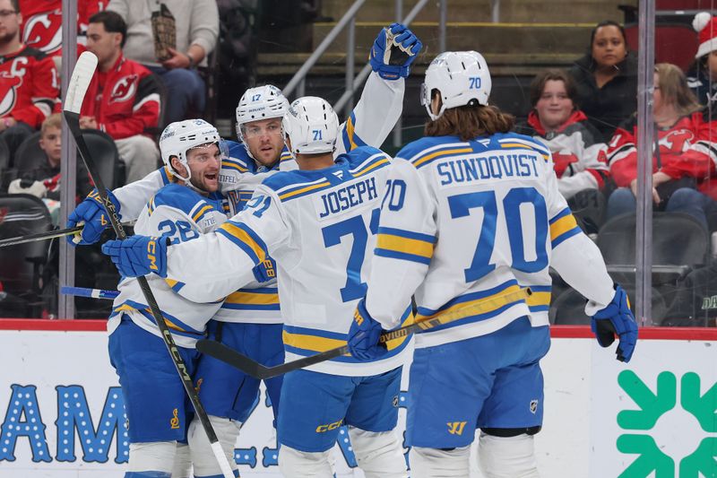 Nov 26, 2025; Newark, New Jersey, USA; St. Louis Blues defenseman Cam Fowler (17) celebrates his goal against the New Jersey Devils during the first period at Prudential Center. Mandatory Credit: Ed Mulholland-Imagn Images