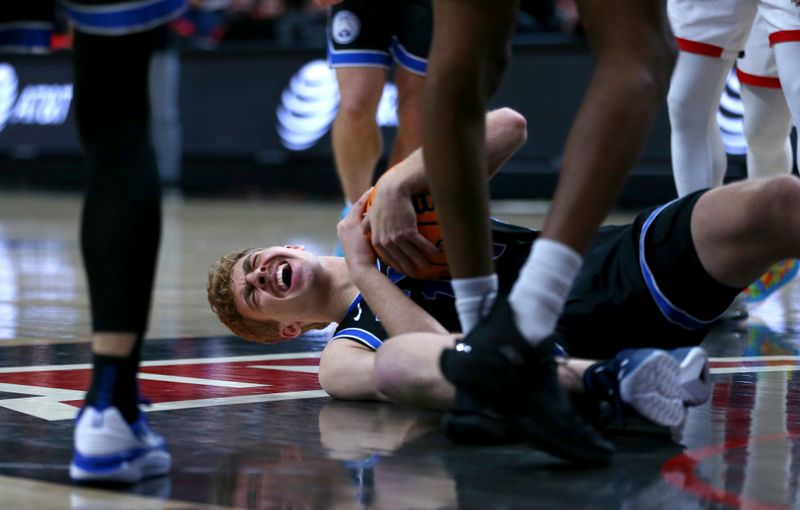 Jan 20, 2024; Lubbock, Texas, USA;  Brigham Young Cougars guard Townsend Tripple (12) reacts after hitting the floor in the second half during the game against the Texas Tech Red Raiders at United Supermarkets Arena. Mandatory Credit: Michael C. Johnson-USA TODAY Sports