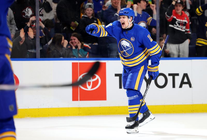 Mar 14, 2024; Buffalo, New York, USA;  Buffalo Sabres defenseman Henri Jokiharju (10) reacts after his team scores a goal during the second period against the New York Islanders at KeyBank Center. Mandatory Credit: Timothy T. Ludwig-USA TODAY Sports