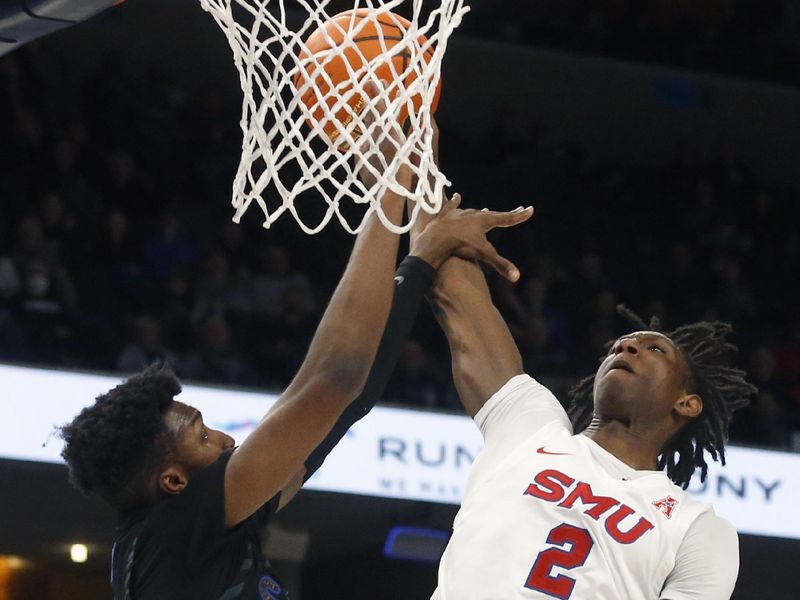 Jan 26, 2023; Memphis, Tennessee, USA; Southern Methodist Mustangs guard Jalen Smith (2) drives to the basket as Memphis Tigers guard Elijah McCadden (0) defends during the second half at FedExForum. Mandatory Credit: Petre Thomas-USA TODAY Sports