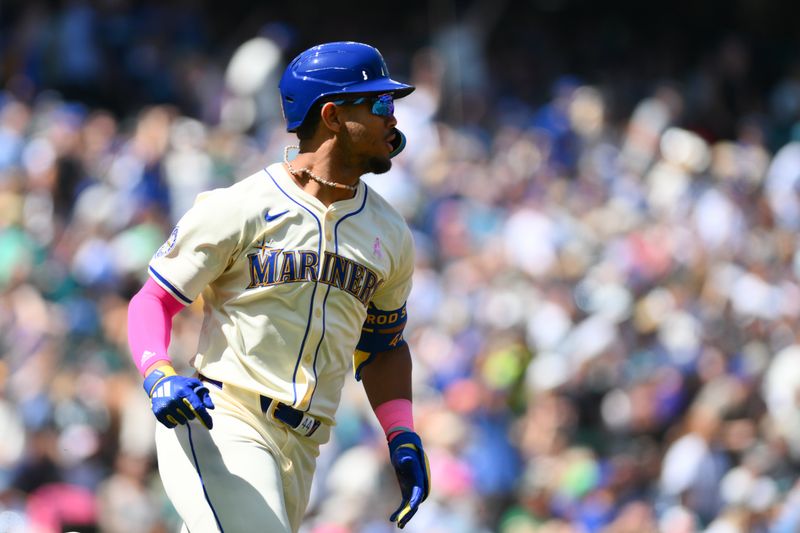 May 12, 2024; Seattle, Washington, USA; Seattle Mariners center fielder Julio Rodriguez (44) runs toward first base after hitting a 2-run home run against the Oakland Athletics during the second inning at T-Mobile Park. Mandatory Credit: Steven Bisig-USA TODAY Sports