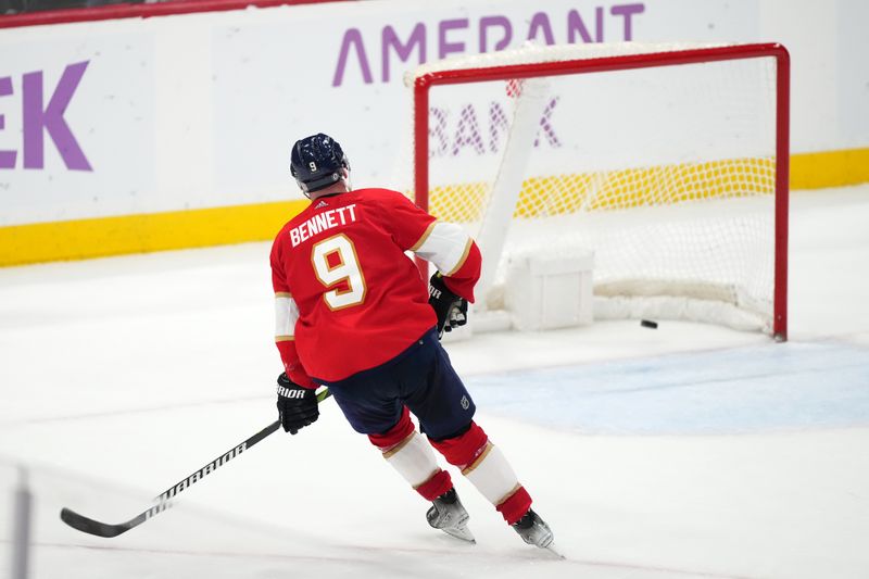 Nov 20, 2023; Sunrise, Florida, USA; Florida Panthers center Sam Bennett (9) scores an empty net goal against the Edmonton Oilers during the third period at Amerant Bank Arena. Mandatory Credit: Jasen Vinlove-USA TODAY Sports