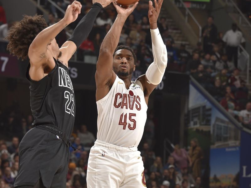 CLEVELAND, OH - NOVEMBER 9: Donovan Mitchell #45 of the Cleveland Cavaliers three point basket during the game against the Brooklyn Nets on November 9, 2024 at Rocket Mortgage FieldHouse in Cleveland, Ohio. NOTE TO USER: User expressly acknowledges and agrees that, by downloading and/or using this Photograph, user is consenting to the terms and conditions of the Getty Images License Agreement. Mandatory Copyright Notice: Copyright 2024 NBAE (Photo by David Liam Kyle/NBAE via Getty Images)