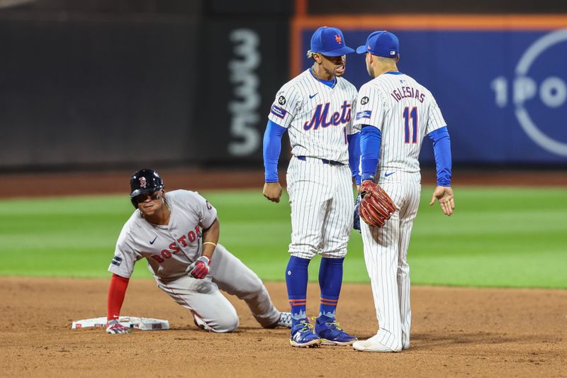 Sep 3, 2024; New York City, New York, USA;  New York Mets shortstop Francisco Lindor (12) and second baseman Jose Iglesias (11) after completing an inning ending double play in the eighth inning against the Boston Red Sox at Citi Field. Mandatory Credit: Wendell Cruz-Imagn Images