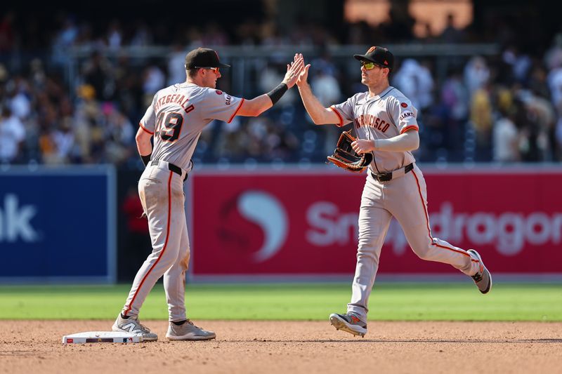 Sep 8, 2024; San Diego, California, USA; San Francisco Giants shortstop Tyler Fitzgerald (49) and San Francisco Giants right fielder Mike Yastrzemski (5) celebrate after defeating the San Diego Padres at Petco Park. Mandatory Credit: Chadd Cady-Imagn Images