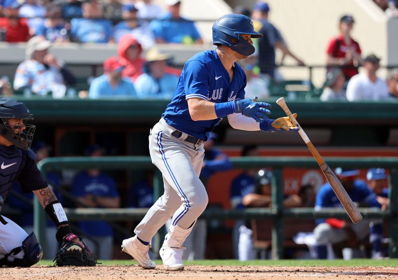 Mar 4, 2023; Lakeland, Florida, USA;  Toronto Blue Jays outfielder Cavan Biggio (8) hits a RBI single during the fourth inning ]against the Detroit Tigers at Publix Field at Joker Marchant Stadium. Mandatory Credit: Kim Klement-USA TODAY Sports