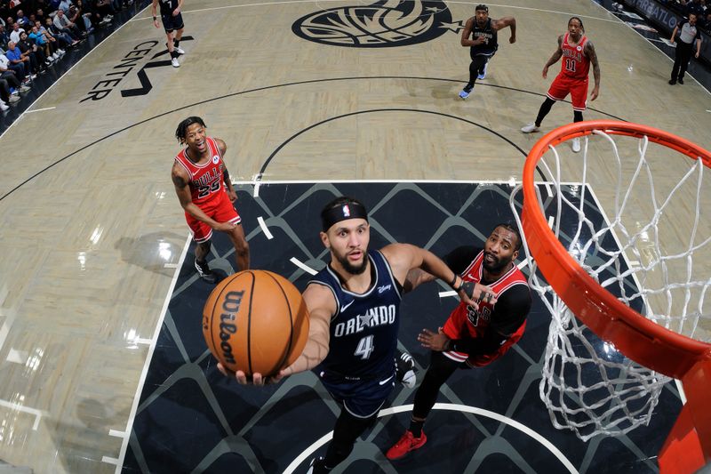 ORLANDO, FL - APRIL 7: Jalen Suggs #4 of the Orlando Magic drives to the basket during the game against the Chicago Bulls on April 7, 2024 at the Kia Center in Orlando, Florida. NOTE TO USER: User expressly acknowledges and agrees that, by downloading and or using this photograph, User is consenting to the terms and conditions of the Getty Images License Agreement. Mandatory Copyright Notice: Copyright 2024 NBAE (Photo by Fernando Medina/NBAE via Getty Images)