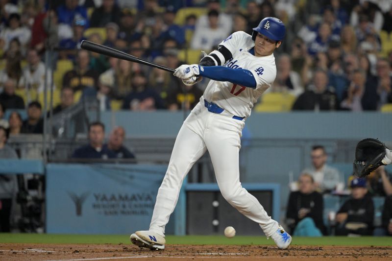 Sep 26, 2024; Los Angeles, California, USA;  Los Angeles Dodgers designated hitter Shohei Ohtani (17) fouls off a ball in the fourth inning against the San Diego Padres at Dodger Stadium. Mandatory Credit: Jayne Kamin-Oncea-Imagn Images