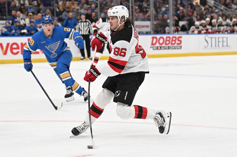 Feb 28, 2026; St. Louis, Missouri, USA; New Jersey Devils center Jack Hughes (86) takes a shot against the St. Louis Blues in the first period at Enterprise Center. Mandatory Credit: Joe Puetz-Imagn Images