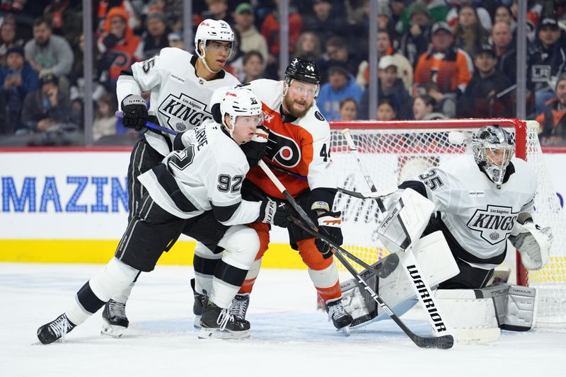 Jan 31, 2026; Philadelphia, Pennsylvania, USA; Los Angeles Kings defenseman Brandt Clarke (92) and Philadelphia Flyers left wing Nicolas Deslauriers (44) battle for position in the second period at Xfinity Mobile Arena. Mandatory Credit: Kyle Ross-Imagn Images
