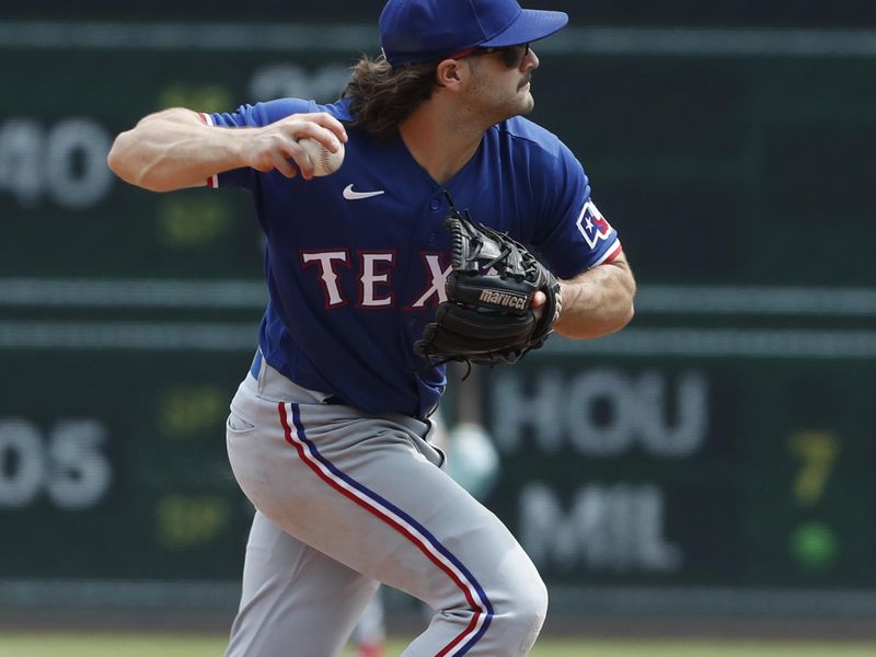 May 24, 2023; Pittsburgh, Pennsylvania, USA; Texas Rangers shortstop Josh Smith (47) throws to first base to retire Pittsburgh Pirates catcher Jason Delay (not pictured) during the ninth inning at PNC Park. Texas won 3-2. Mandatory Credit: Charles LeClaire-USA TODAY Sports