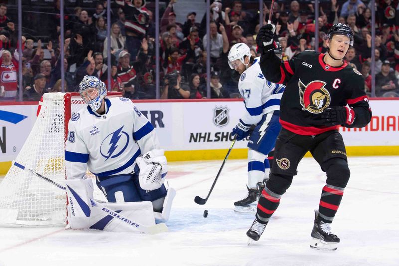 Oct 19, 2024; Ottawa, Ontario, CAN; Tampa Bay Lightning goalie Andrei Vasilevskiy (88) reacts to a goal scored by the Ottawa Senators as left wing Brady Tkachuk (7) celebrates in the first period at the Canadian Tire Centre. Mandatory Credit: Marc DesRosiers-Imagn Images