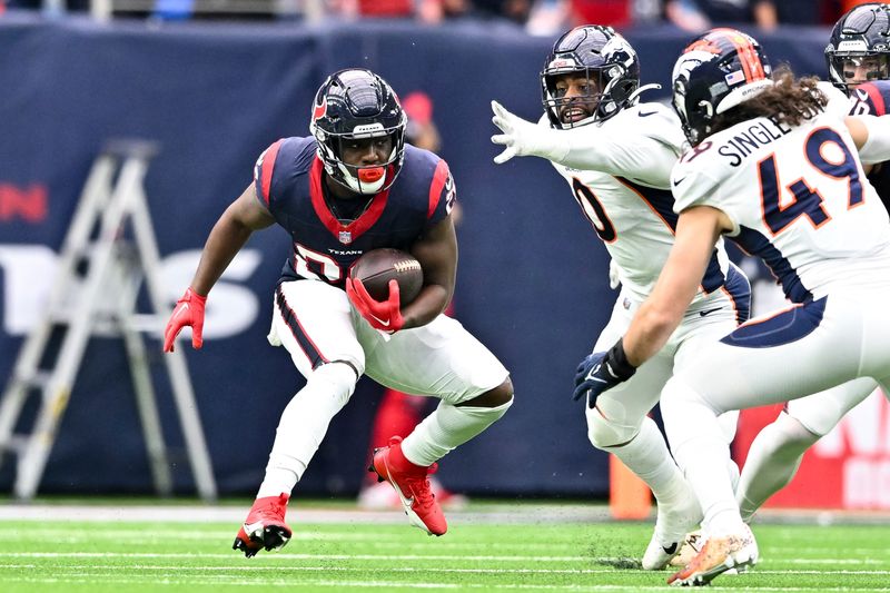 Houston Texans running back Devin Singletary (26) in action during an NFL football game against the Denver Broncos, Sunday, Dec 3, 2023, in Houston. (AP Photo/Maria Lysaker)