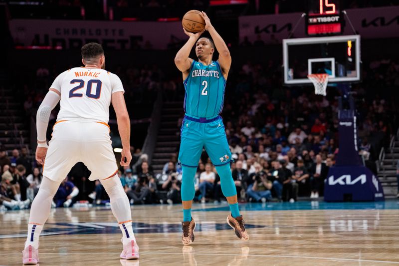 CHARLOTTE, NORTH CAROLINA - MARCH 15: Grant Williams #2 of the Charlotte Hornets shoots the ball while guarded by Jusuf Nurkic #20 of the Phoenix Suns in the second quarter during their game at Spectrum Center on March 15, 2024 in Charlotte, North Carolina. NOTE TO USER: User expressly acknowledges and agrees that, by downloading and or using this photograph, User is consenting to the terms and conditions of the Getty Images License Agreement. (Photo by Jacob Kupferman/Getty Images)