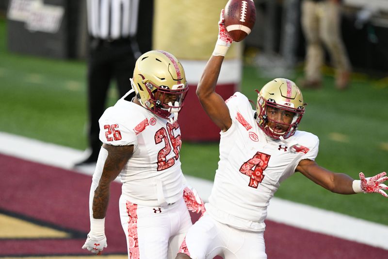 Nov 14, 2020; Chestnut Hill, Massachusetts, USA;  Boston College Eagles wide receiver Zay Flowers (4) celebrates with running back David Bailey (26) after scoring a touchdown against the Notre Dame Fighting Irish during the first half at Alumni Stadium. Mandatory Credit: Brian Fluharty-USA TODAY Sports