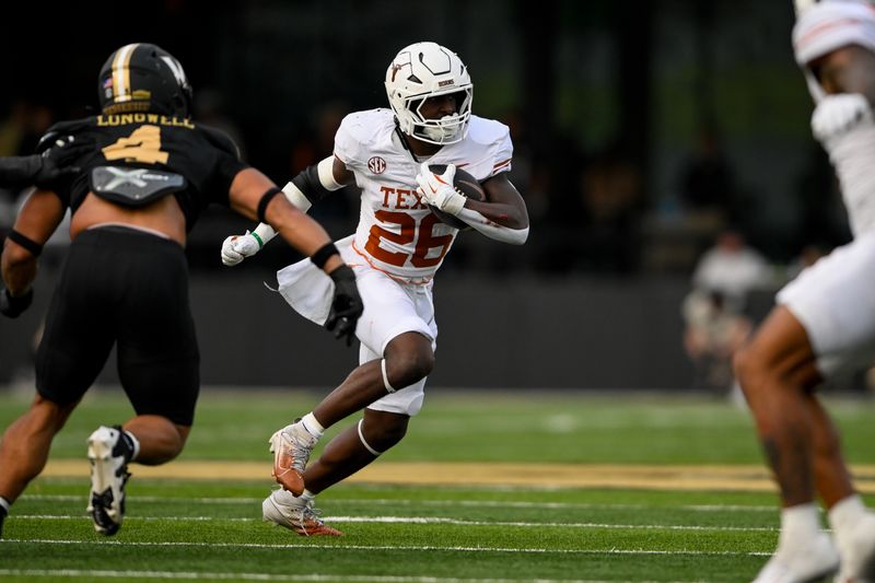 Oct 26, 2024; Nashville, Tennessee, USA; Texas Longhorns running back Quintrevion Wisner (26) runs the ball against the Vanderbilt Commodores during the first half at FirstBank Stadium. Mandatory Credit: Steve Roberts-Imagn Images