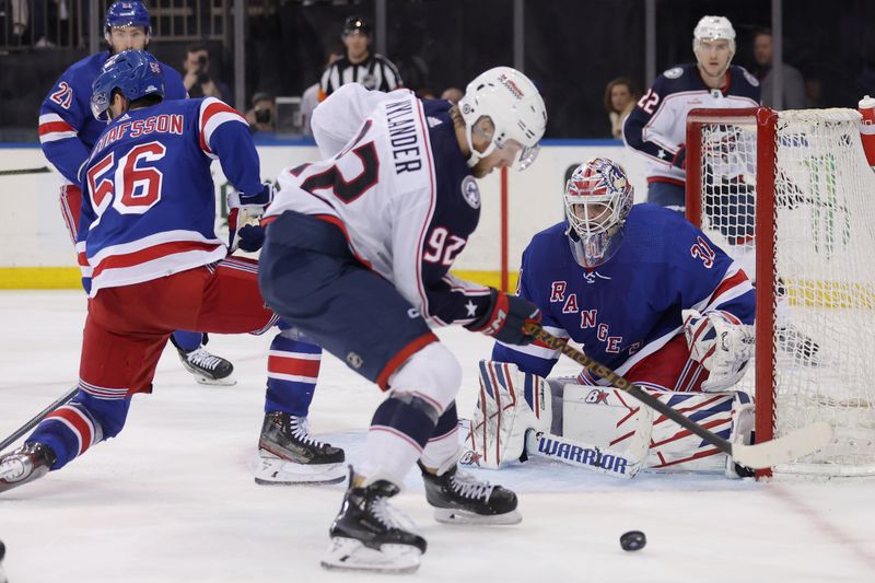 Feb 28, 2024; New York, New York, USA; New York Rangers goaltender Igor Shesterkin (31) tends net against Columbus Blue Jackets left wing Alexander Nylander (92) in front of Rangers defenseman Erik Gustafsson (56) during the third period at Madison Square Garden. Mandatory Credit: Brad Penner-USA TODAY Sports