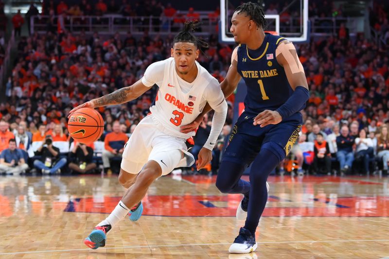 Jan 14, 2023; Syracuse, New York, USA; Syracuse Orange guard Judah Mintz (3) drives to the basket as Notre Dame Fighting Irish guard J.J. Starling (1) defends during the first half at the JMA Wireless Dome. Mandatory Credit: Rich Barnes-USA TODAY Sports