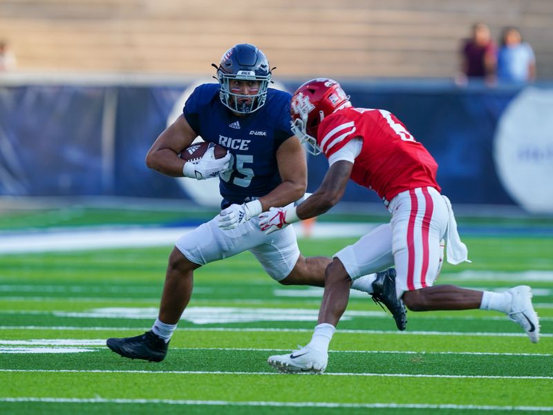 Sep 11, 2021; Houston, Texas, USA; Rice Owls fullback Brendan Suckley (85) runs the ball against Houston Cougars cornerback Damarion Williams (6) in the first half at Rice Stadium. Mandatory Credit: Daniel Dunn-USA TODAY Sports