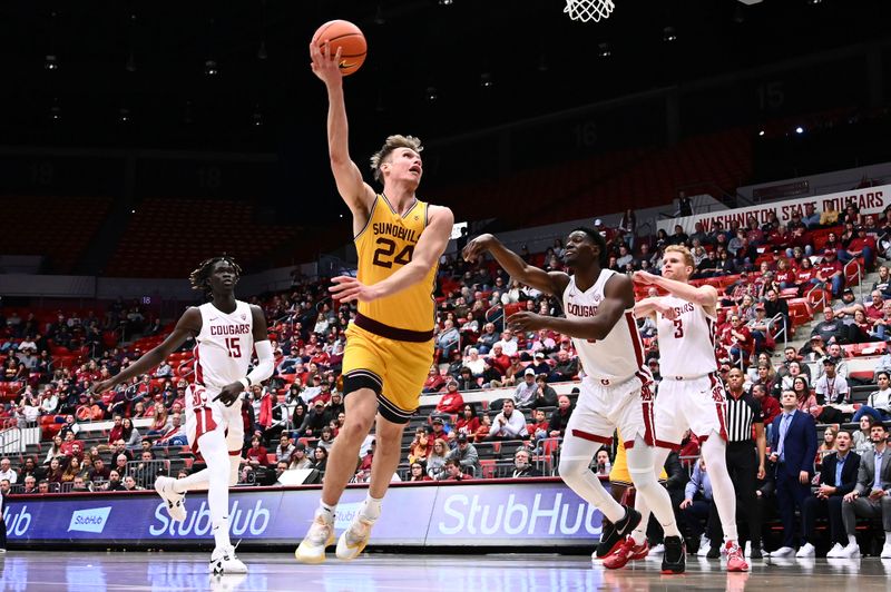 Jan 28, 2023; Pullman, Washington, USA; Arizona State Sun Devils forward Duke Brennan (24) shoots the ball against Washington State Cougars center Adrame Diongue (15) in the first half at Friel Court at Beasley Coliseum. Mandatory Credit: James Snook-USA TODAY Sports