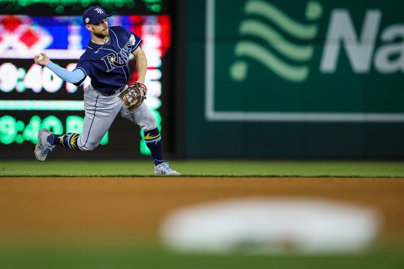 Apr 3, 2023; Washington, District of Columbia, USA; Tampa Bay Rays second baseman Brandon Lowe (8) throws to first against the Washington Nationals during the seventh inning at Nationals Park. Mandatory Credit: Scott Taetsch-USA TODAY Sports