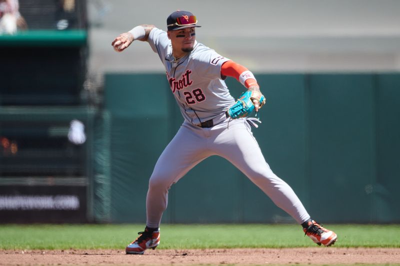 Aug 10, 2024; San Francisco, California, USA; Detroit Tigers infielder Javier Baez (28) throws the ball to first base against the San Francisco Giants during the second inning at Oracle Park. Mandatory Credit: Robert Edwards-USA TODAY Sports