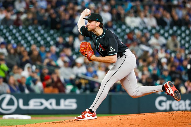 Apr 28, 2024; Seattle, Washington, USA; Arizona Diamondbacks starting pitcher Brandon Pfaadt (32) throws against the Seattle Mariners during the first inning at T-Mobile Park. Mandatory Credit: Joe Nicholson-USA TODAY Sports