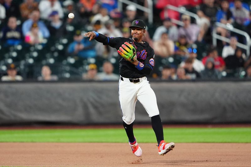 Jun 14, 2024; New York City, New York, USA; New York Mets shortstop Francisco Lindor (12) throws out San Diego Padres right fielder Frenando Tatis Jr. (not pictured) after fielding a ground ball  during the fourth inning at Citi Field. Mandatory Credit: Gregory Fisher-USA TODAY Sports